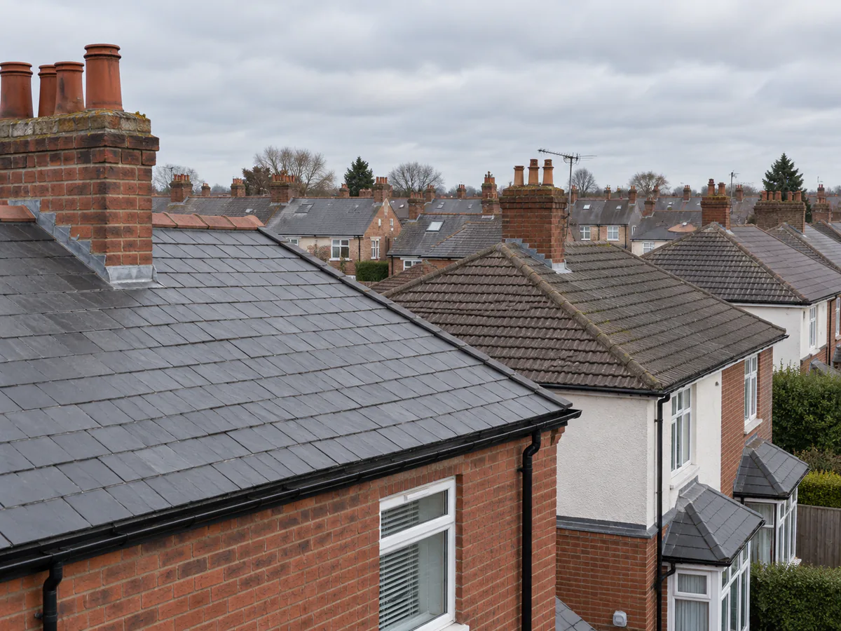 Overcast view across ordinary Southport-style rooftops and chimneys.